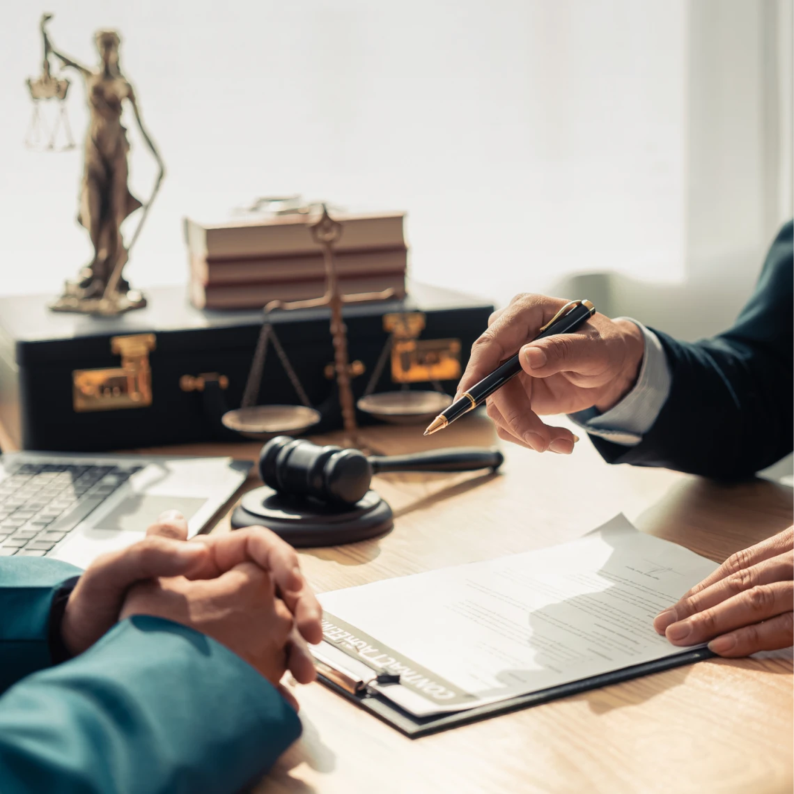 Attorney consulting with client over paperwork